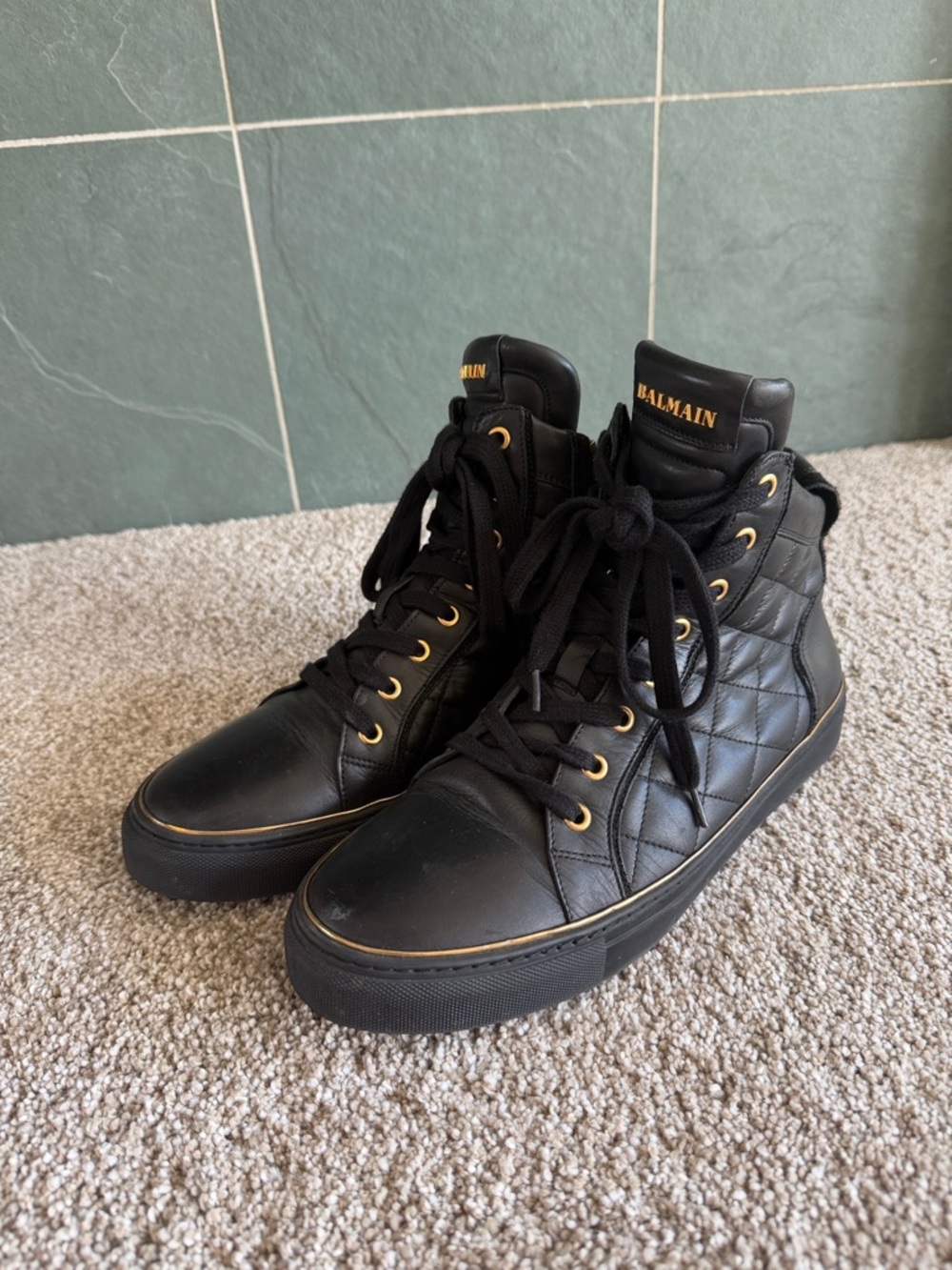 Balmain Black Quilted High-Top Sneakers with Gold Accents